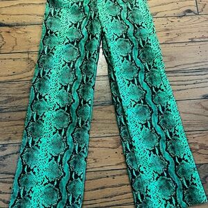 Green snakeskin print flare faux leather pants.